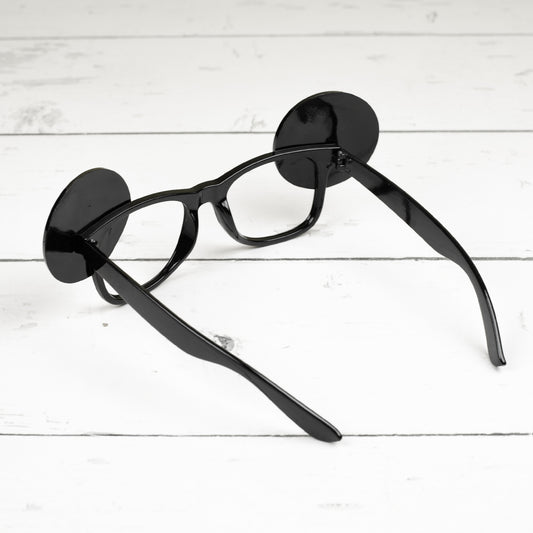 Rückansicht der Spaßbrille 18 im Verkehrszeichen-Look aus schwarzem Kunststoff