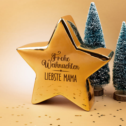 Goldfarbener Keramikstern von Leonardo mit „Frohe Weihnachten“ und personalisiertem Namen, weihnachtlich dekoriert