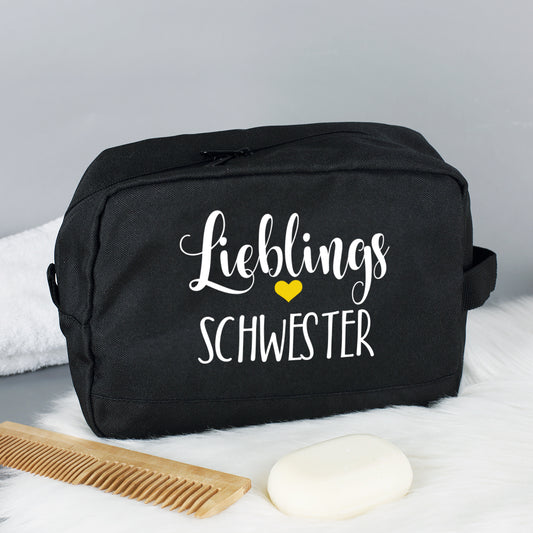 Kulturbeutel mit "Lieblings"-Motiv und Wunschaufdruck in Schwarz seitlich fotografiert