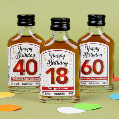 Drei Mini-Kräuterliköre mit Etiketten „Happy Birthday 18“, „40 – Wohlfühl-Alter erreicht“ und „60 – Alter ist wie jung – nur besser“