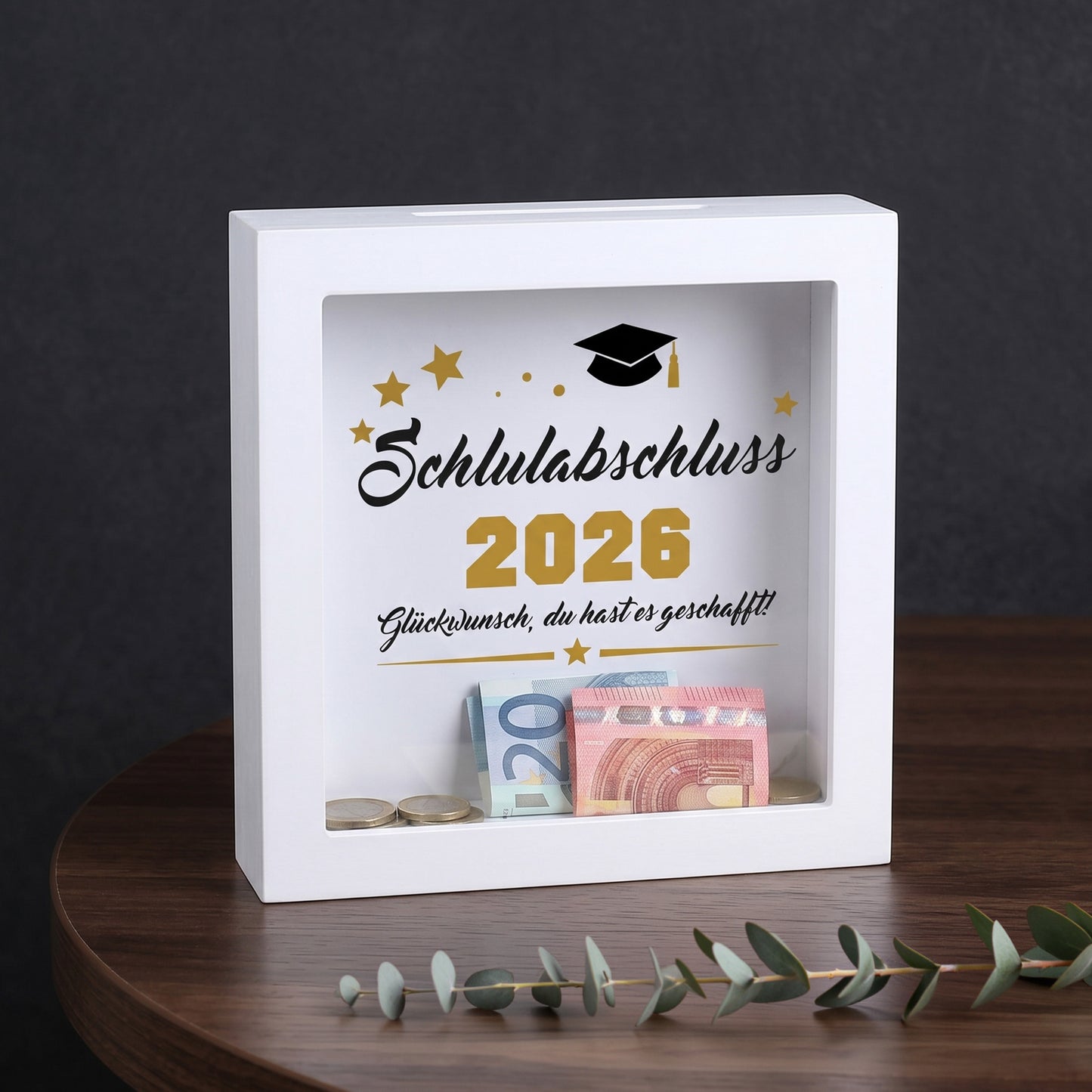 Bilderrahmen-Spardose „Schulabschluss 2026“ mit Geldscheinen und Münzen als Abschlussgeschenk