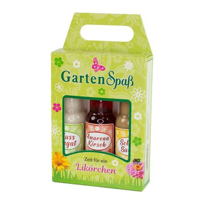 Likör Geschenkbox „Gartenspaß“ mit drei Fläschchen in der Verpackung auf weißem Hintergrund