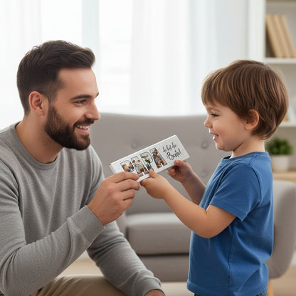Kind übergibt die XXL Milchschokolade „Papa du bist der Beste!“ mit 4 Fotos an seinen Vater