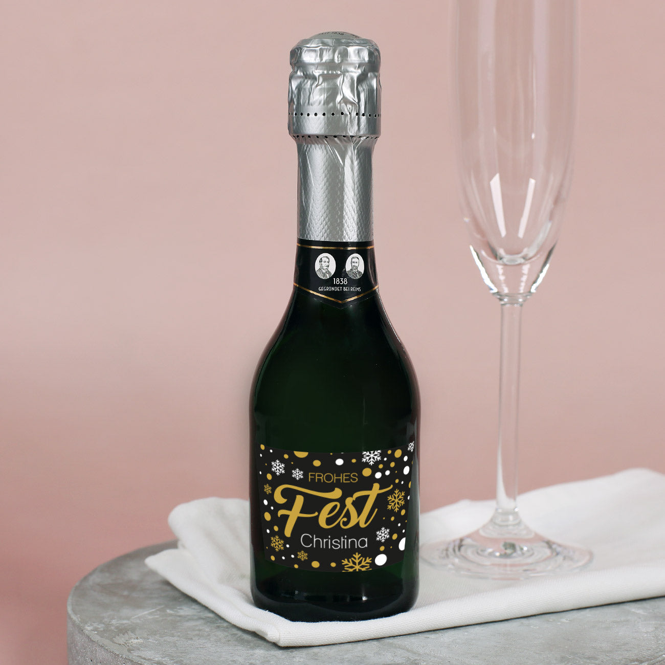 Sektflasche "Frohes Fest" mit Schneeflocken und Name