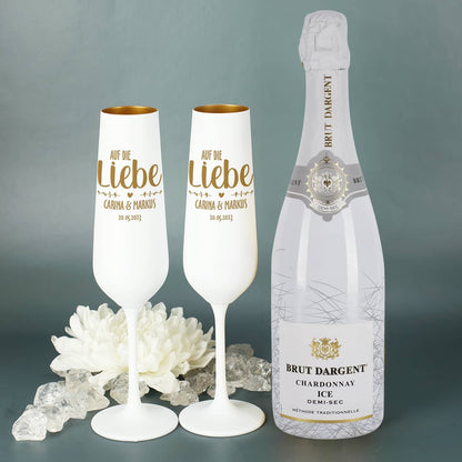 Weiß-Goldene Sektgläser und edel verpackter Sekt
