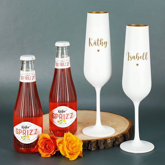 Zwei Käfer Sprizz Flaschen und zwei weiß-goldene Sektgläser