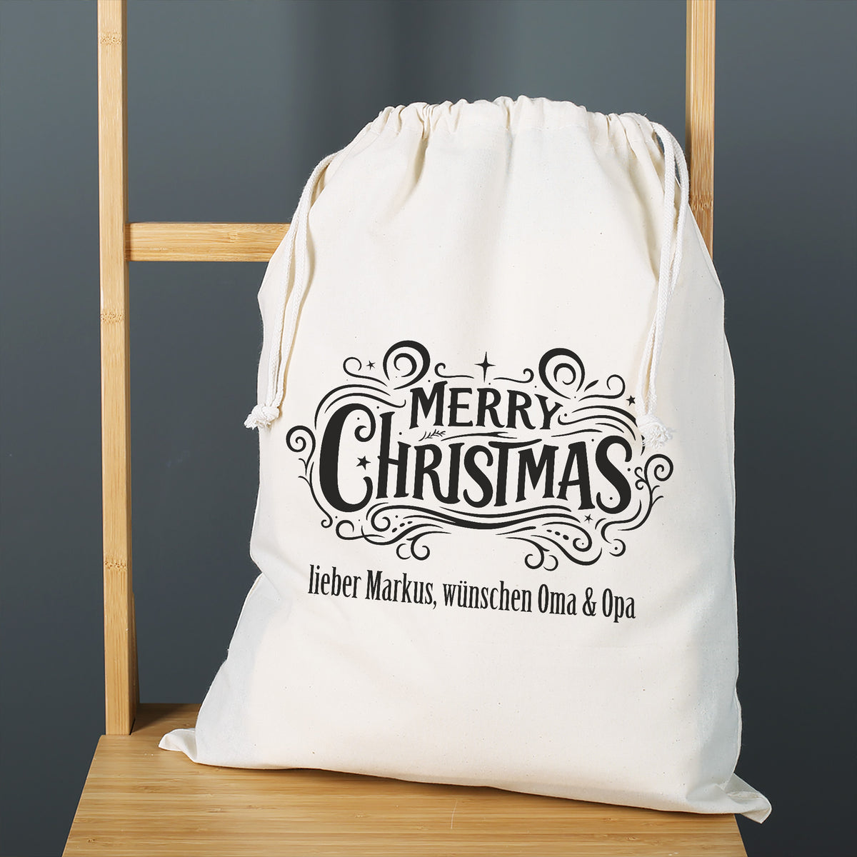 Personalisierter Baumwoll-Geschenksack mit Merry Christmas Motiv und Wunschtext zu Weihnachten