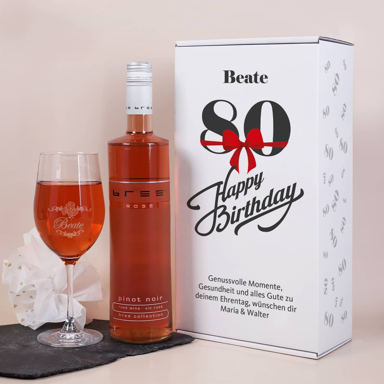 Weinset zum 80. Geburtstag mit Weinglas und Roséwein in bedruckter Geschenkverpackung