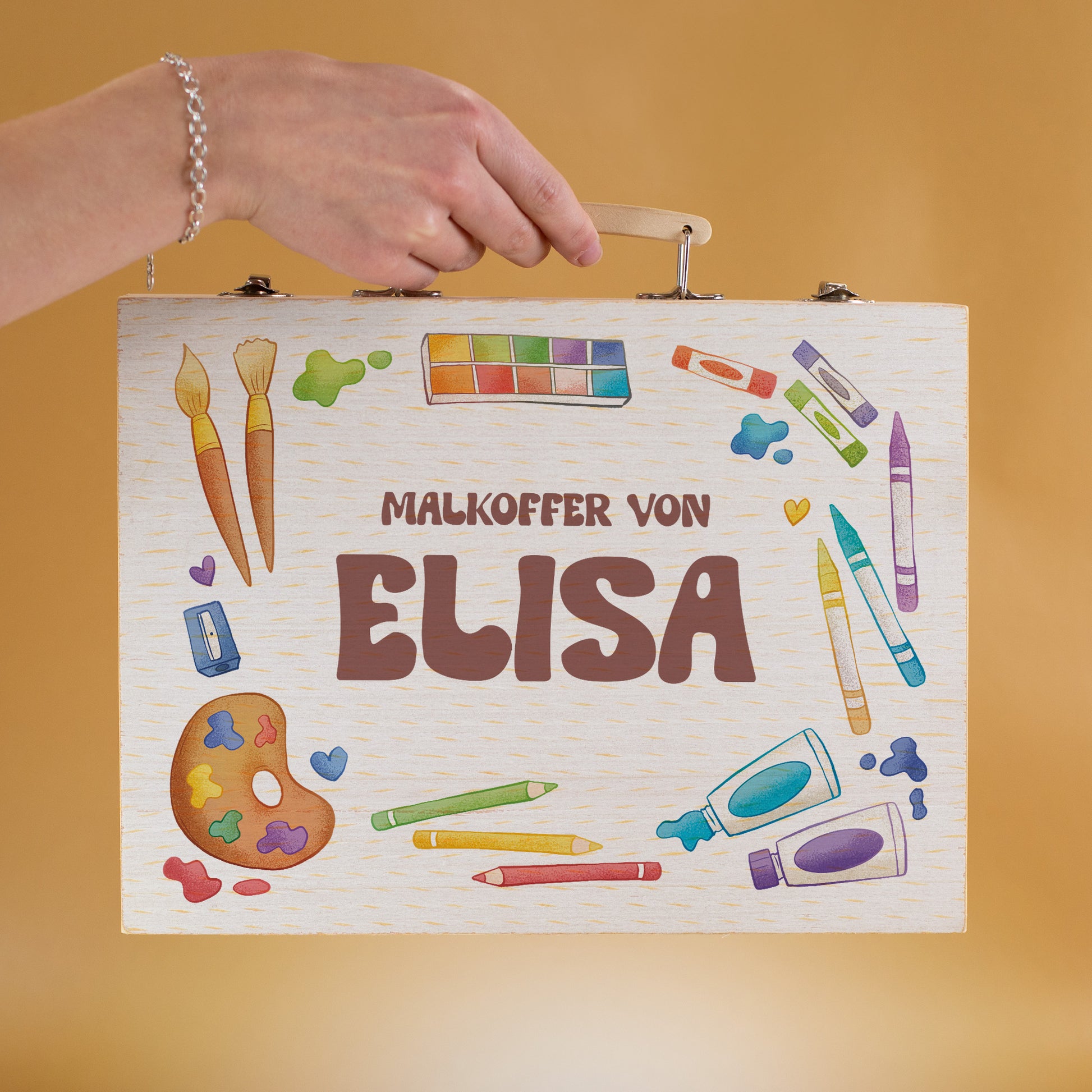 Personalisierter Malkoffer mit Name „Elisa“ in Kinderhand gehalten