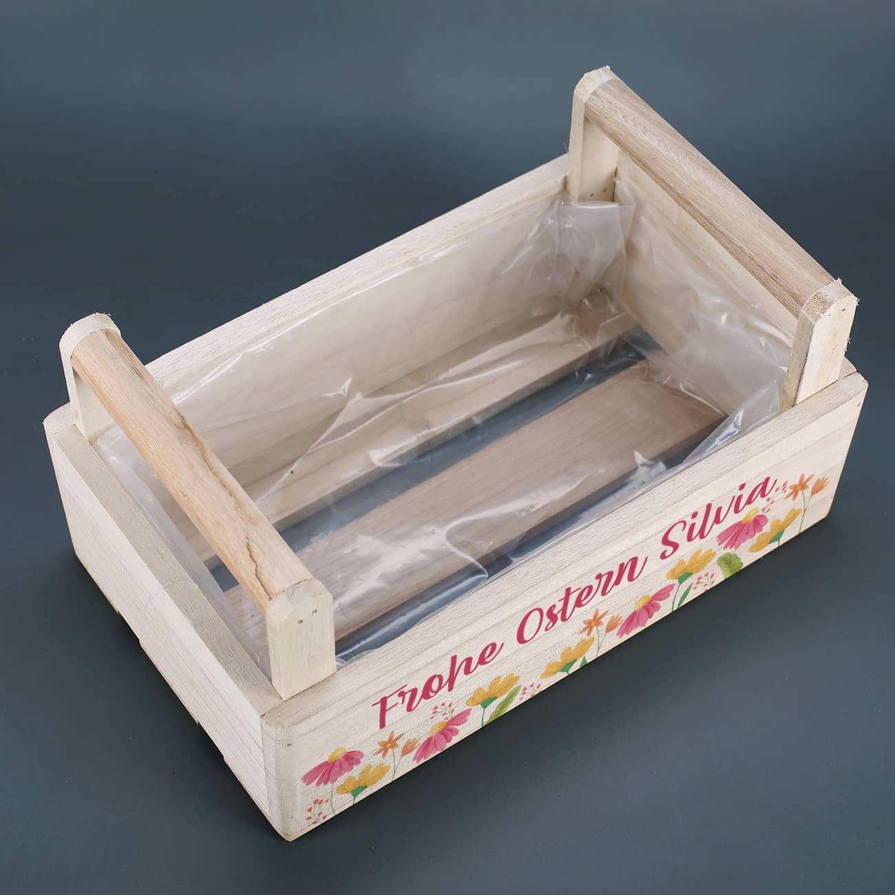 Mit zwei Tragegriffen und Folie ausgekleidet