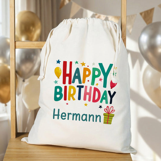 Stoffbeutel mit buntem Happy Birthday Motiv und individuellem Namen als Geschenkverpackung