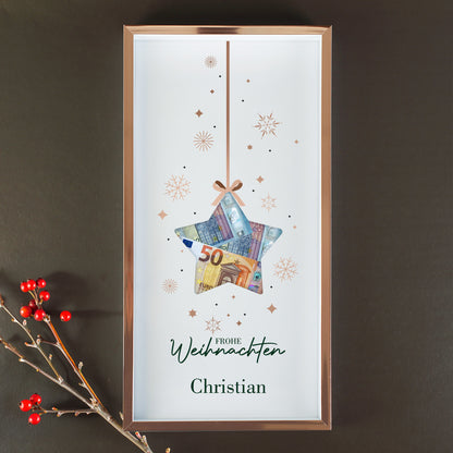 Personalisierter Bilderrahmen zu Weihnachten mit Name Christian, Sternmotiv und Geldscheinen in der Aussparung an dunkler Wand