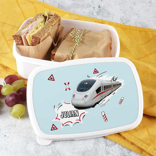 Brotdose ICE Motiv – geöffnet mit belegten Broten und Trauben auf gelben Tuch