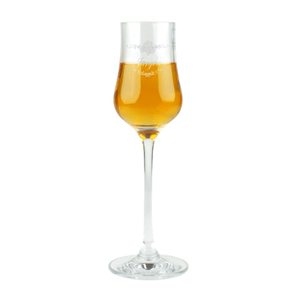 Freigestellte Aufnahme des Leonardo Grappaglases mit Gravur „Jürgen“ und goldenem Grappa.
