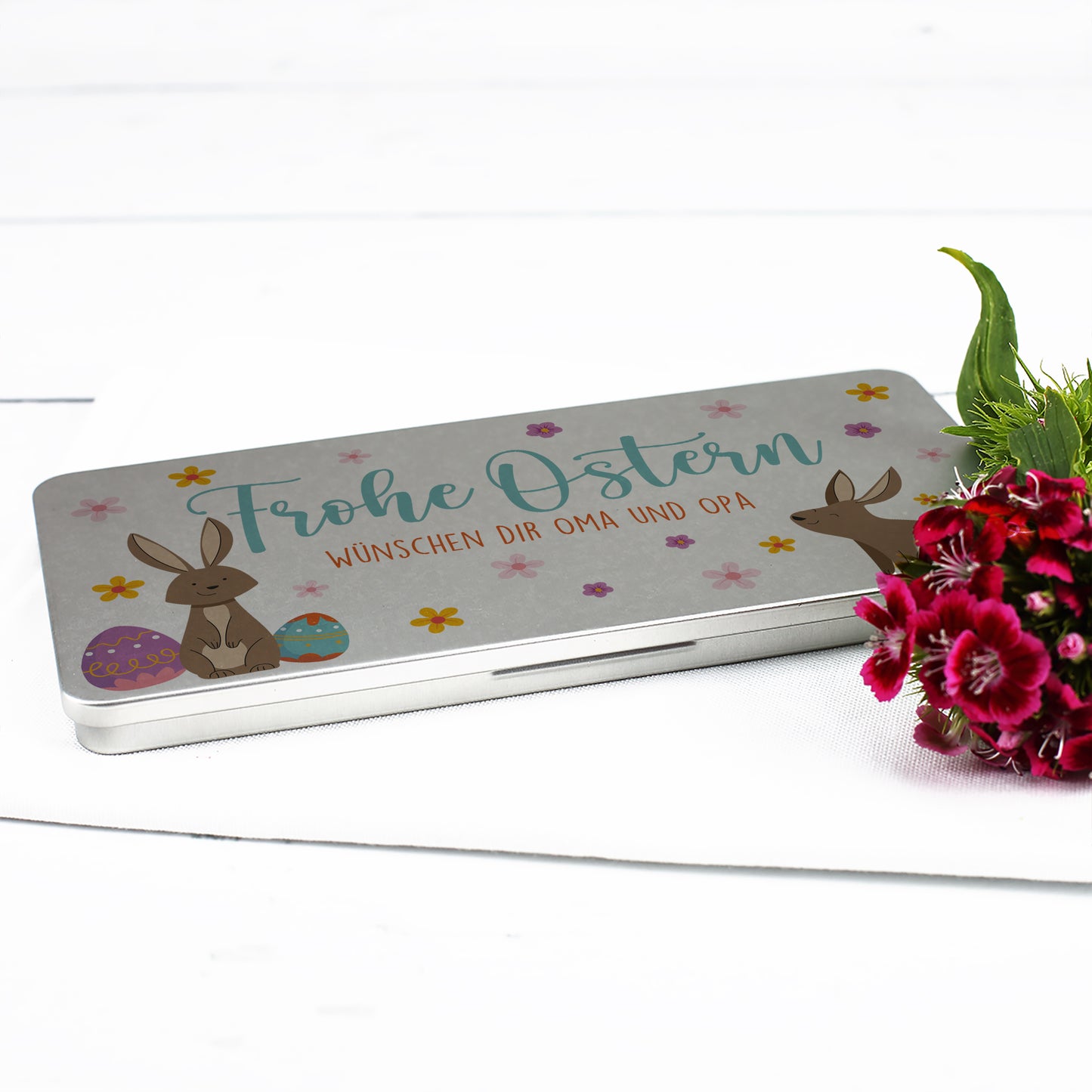 Flache Metalldose mit Osterdesign und Schriftzug Frohe Ostern als Geldgeschenkverpackung