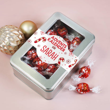 Adventskalender in Metalldose mit Sichtfenster gefüllt mit 24 Lindorkugeln