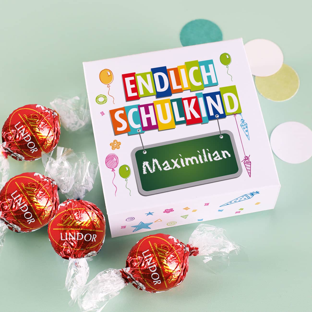Geschenkverpackung zur Einschulung mit 4 Lindorkugeln und bunten Aufdruck