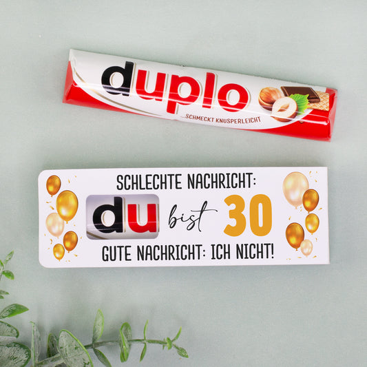 duplo Riegel und personalisierte Geburtstagsverpackung mit Ballonmotiv nebeneinander