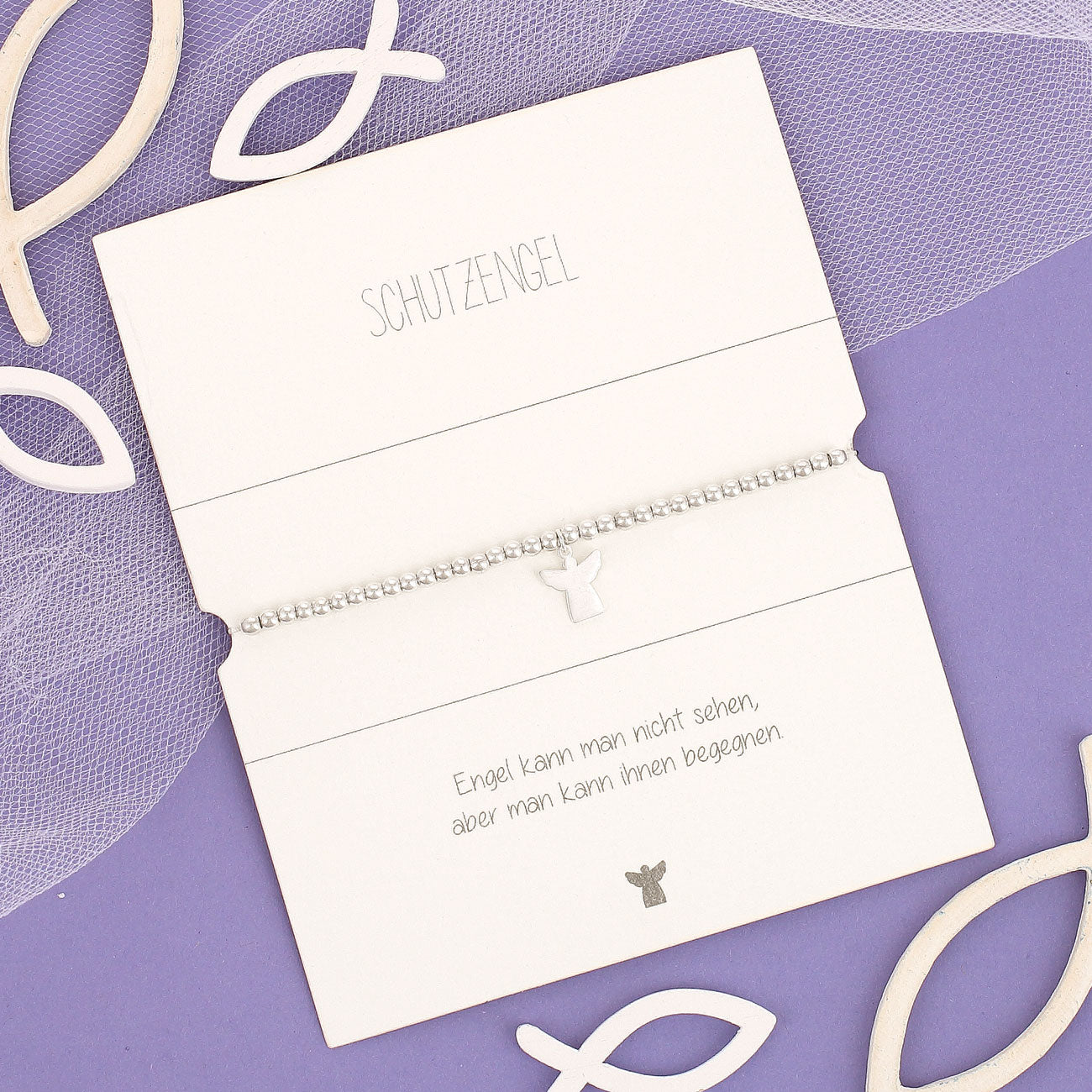 Schutzengel Armband zur Konfirmation auf lila Hintergrund