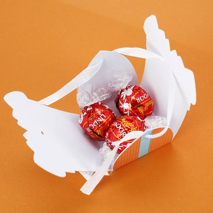 3 zartschmelzende Lindorkugeln in Schachtel mit Schleife