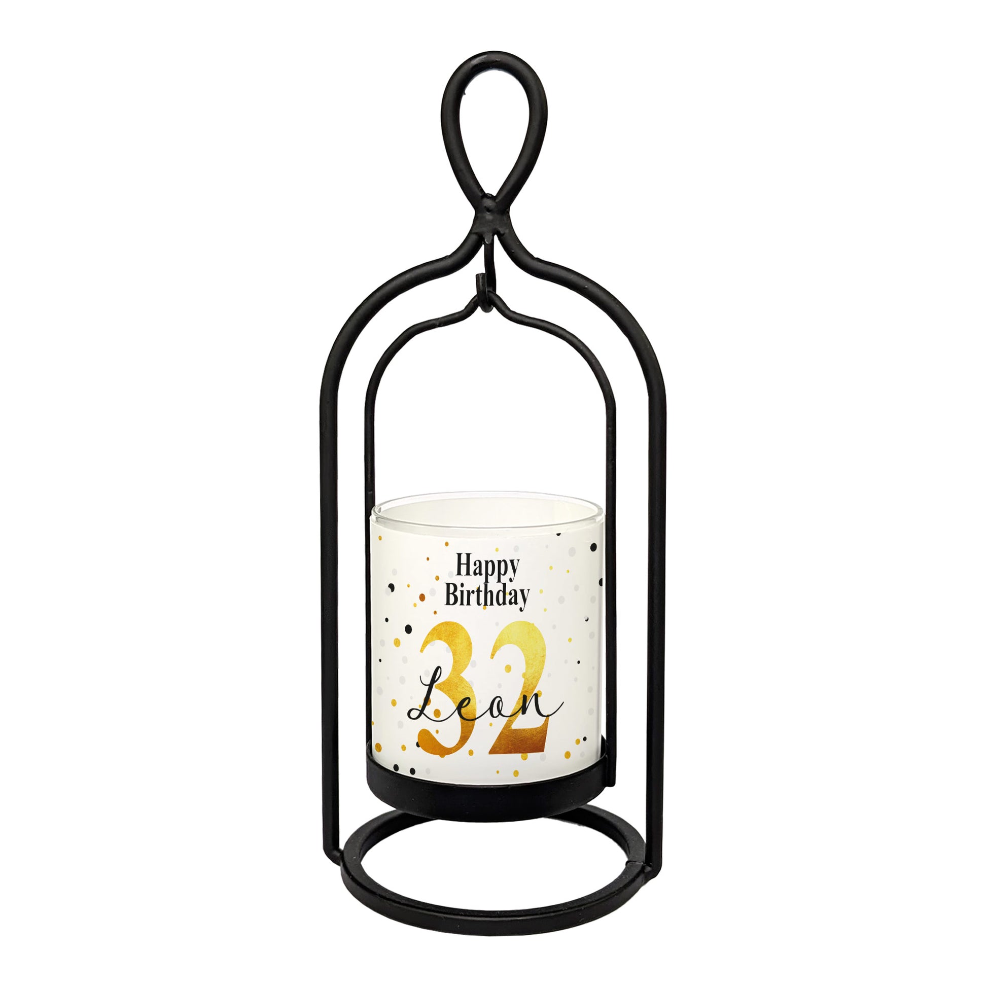 Freigestelltes Produktbild des Windlichts von Ritzenhoff mit weiß-goldener Banderole „Happy Birthday“, personalisiert mit Name und Alter, im schwarzen Metallrahmen – frontal fotografiert auf weißem Hintergrund.