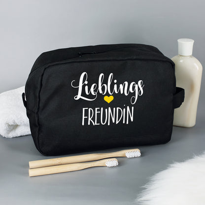 Kulturbeutel mit "Lieblings"-Motiv und Wunschaufdruck in Schwarz mit Zahnbürsten