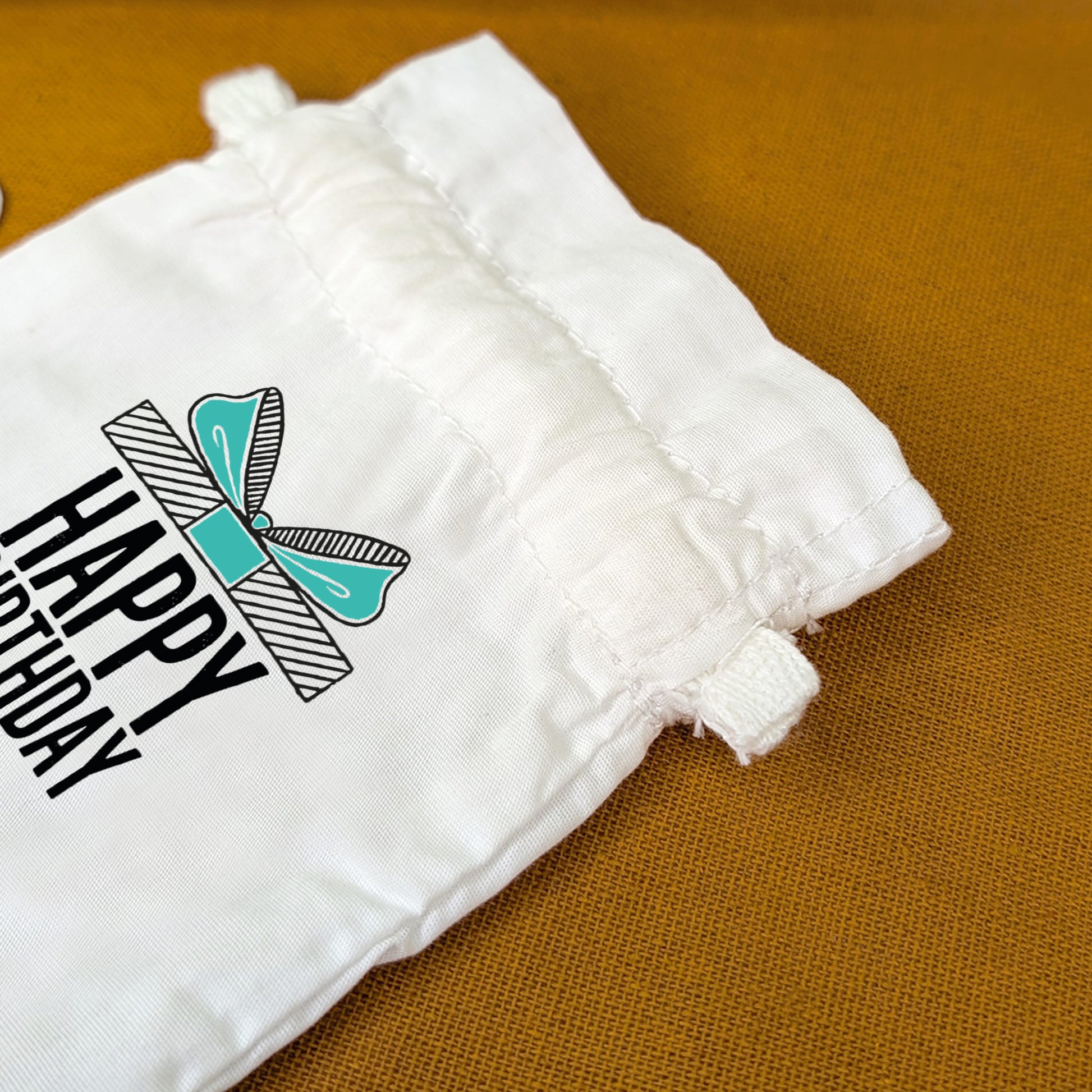 Detailansicht des Zuziehverschlusses am Baumwollsäckchen