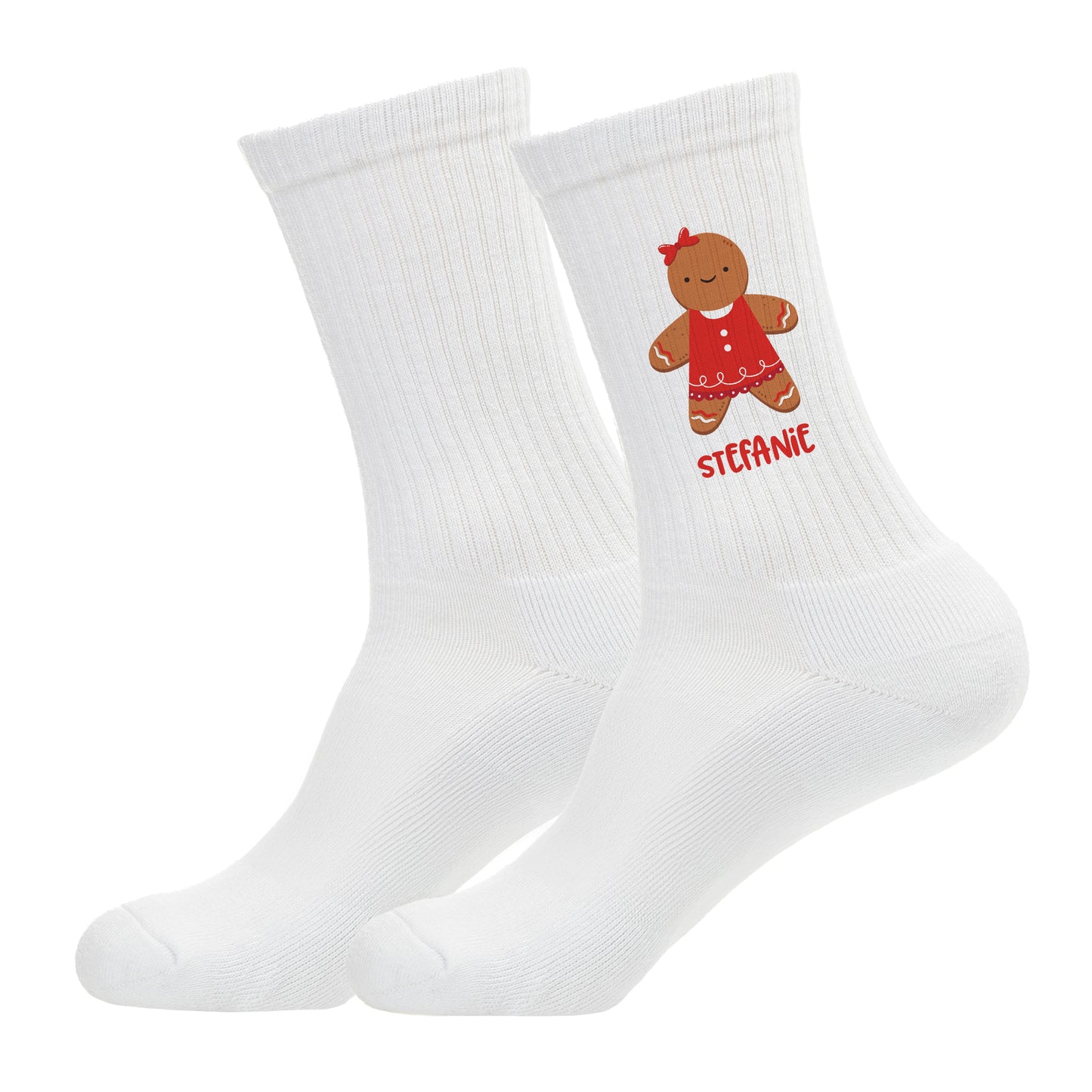 Freigestellte weiße Socken mit Lebkuchenfrau-Motiv und rotem Namensdruck.