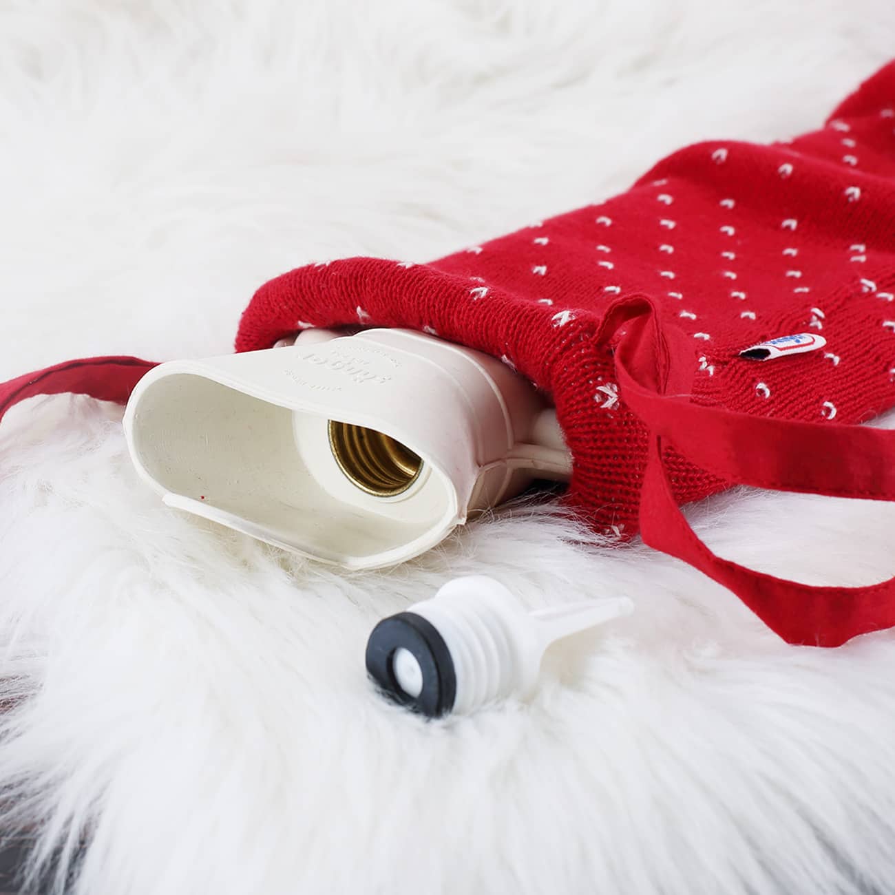 Schlauch-Wärmflasche bestickt