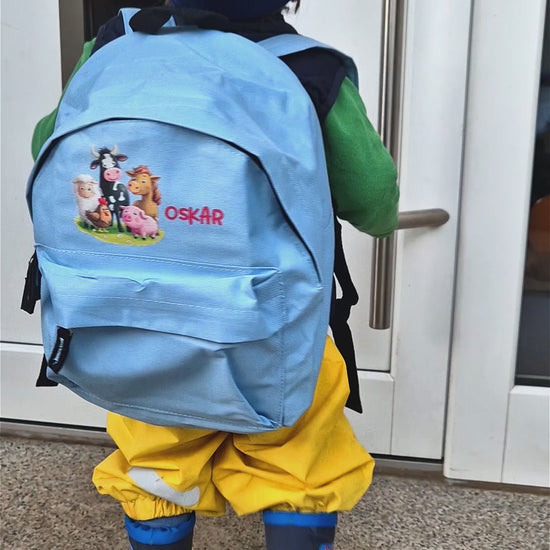 Kinder-Rucksack in blau oder rosa mit dem Namen und Bauernhof-Motiv