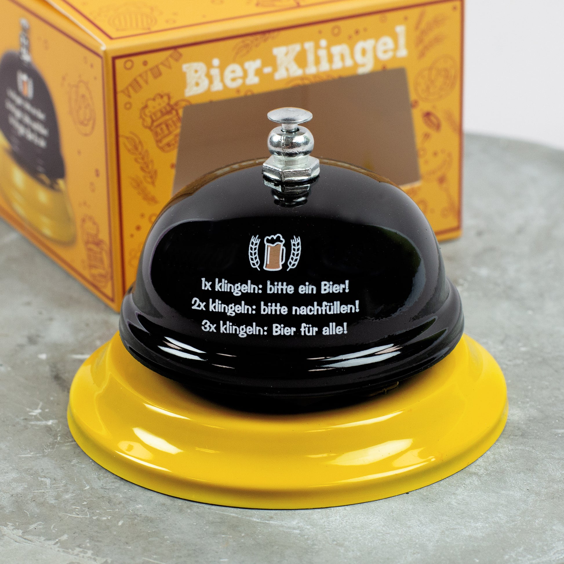 Bier-Klingel mit gelbem Sockel und schwarzer Glocke, witzige Geschenkidee für Bierfreunde