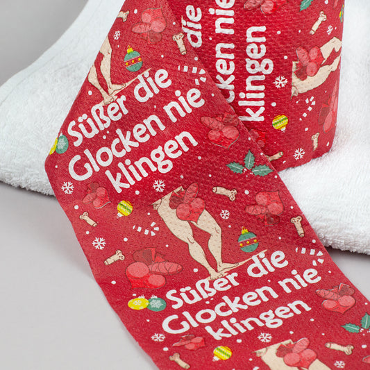 Detailansicht Toilettenpapier Weihnachten rot mit Spruch „Süßer die Glocken nie klingen“ und weihnachtlichen Motiven